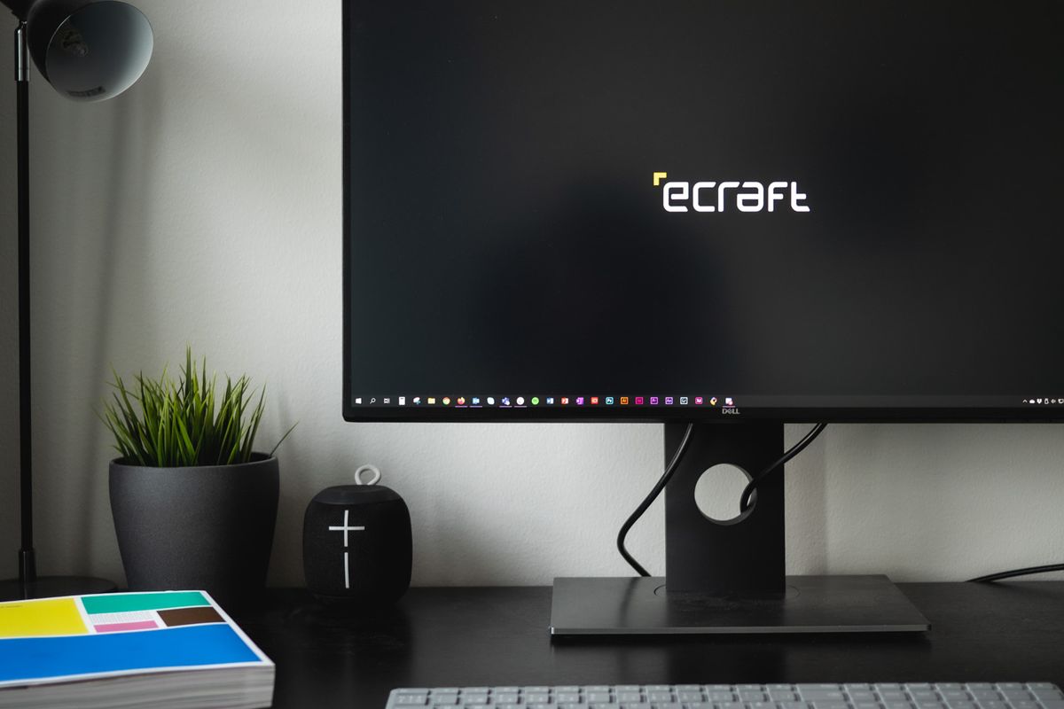 eCraft logo shown as a lock screen on a desk monitor