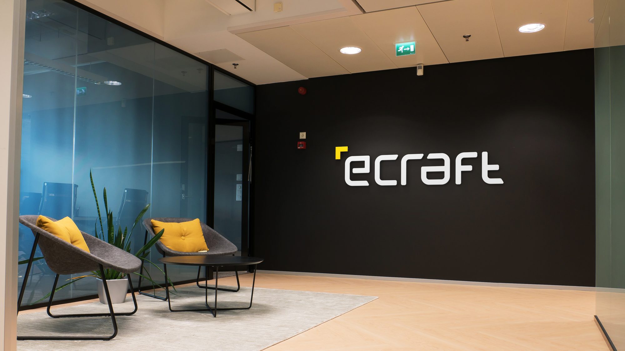 eCraft office lobby with the brand wordmark on a black wall