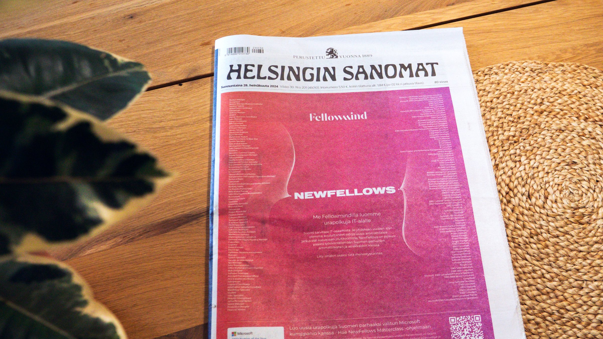 NewFellows campaign as the front page of Helsingin Sanomat, lying on a wooden table